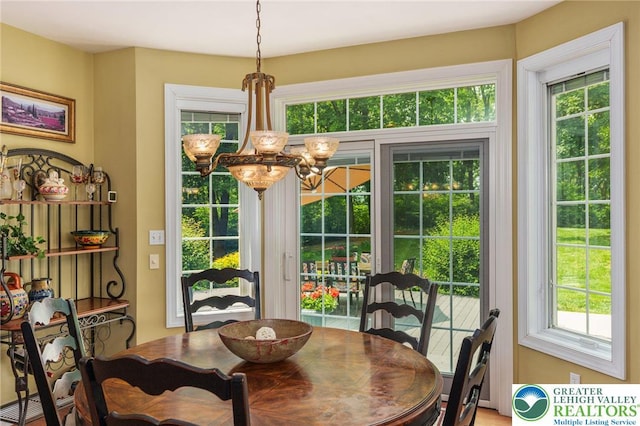 6335 Sweetbriar Ln, Upper Milford Twp, PA 18092 - dining area with a chandelier and plenty of natural light