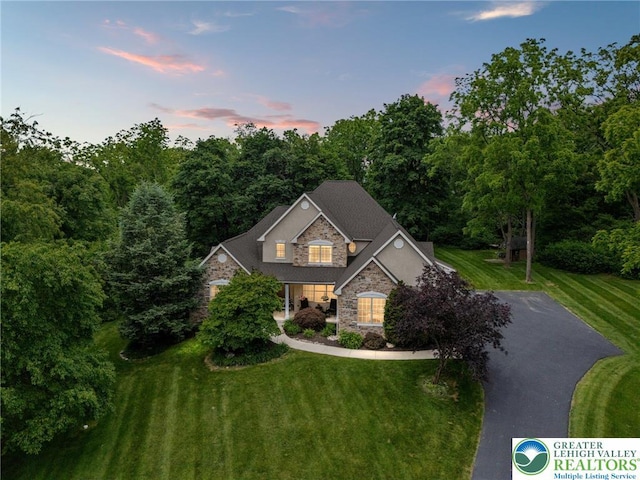 6335 Sweetbriar Ln, Upper Milford Twp, PA 18092 - view of front of home with stone siding and a front lawn