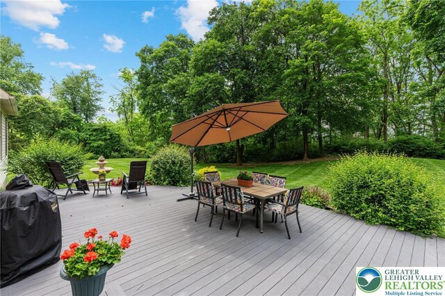6335 Sweetbriar Ln, Upper Milford Twp, PA 18092 - wooden deck with outdoor dining space, area for grilling, a lawn, and view of scattered trees