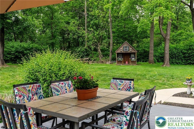 6335 Sweetbriar Ln, Upper Milford Twp, PA 18092 - view of patio featuring outdoor dining area and an outdoor structure