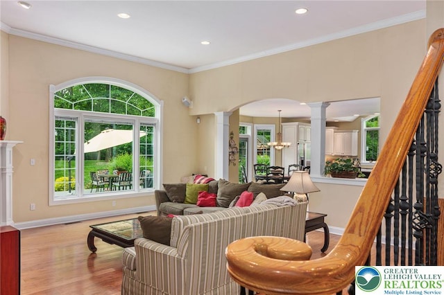 6335 Sweetbriar Ln, Upper Milford Twp, PA 18092 - living area with ornate columns, arched walkways, light wood-style floors, recessed lighting, and ornamental molding