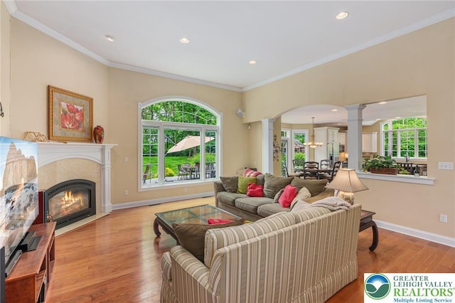 6335 Sweetbriar Ln, Upper Milford Twp, PA 18092 - living room featuring ornate columns, wood finished floors, ornamental molding, arched walkways, and recessed lighting
