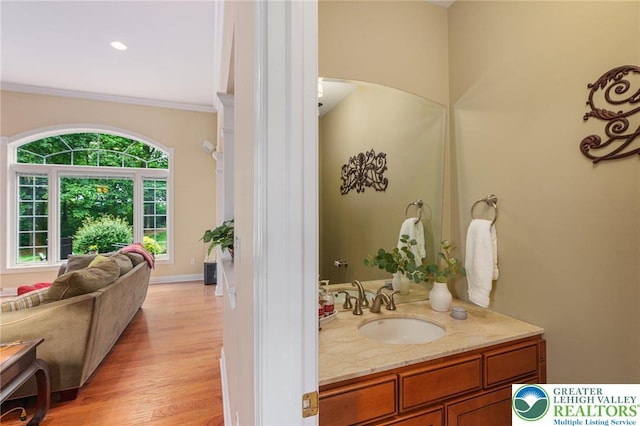6335 Sweetbriar Ln, Upper Milford Twp, PA 18092 - bathroom featuring vanity, crown molding, and wood finished floors