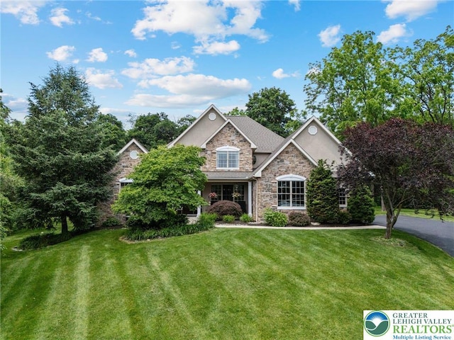 6335 Sweetbriar Ln, Upper Milford Twp, PA 18092 - view of front facade with stone siding and a front yard
