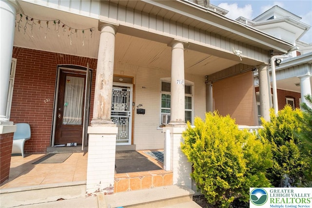 719 N 11th St, Allentown City, PA 18102 - entrance to property featuring a porch and brick siding