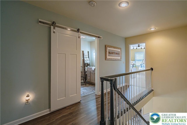 1770 Maplewood Ln, Lower Macungie Twp, PA 18103 - corridor with an upstairs landing, dark wood finished floors, a barn door, baseboards, and recessed lighting
