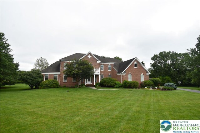 55 Forrest Stand Dr, Easton, PA 18042 - view of front of home with brick siding and a front yard