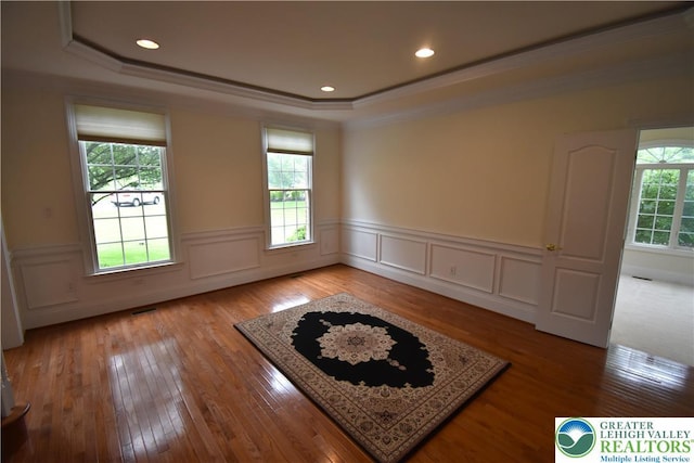 55 Forrest Stand Dr, Easton, PA 18042 - empty room featuring crown molding, a raised ceiling, a wainscoted wall, light wood-style flooring, and recessed lighting