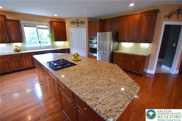 55 Forrest Stand Dr, Easton, PA 18042 - kitchen with appliances with stainless steel finishes, light wood-style floors, light stone counters, and recessed lighting