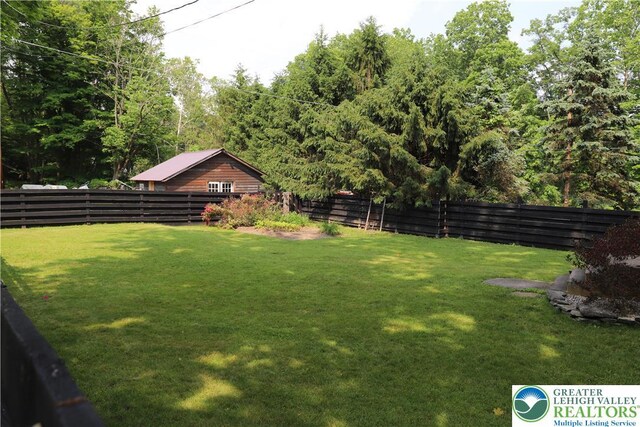 118 Burgoon Rd, Stroud Twp, PA 18301 - fenced backyard featuring a forest view