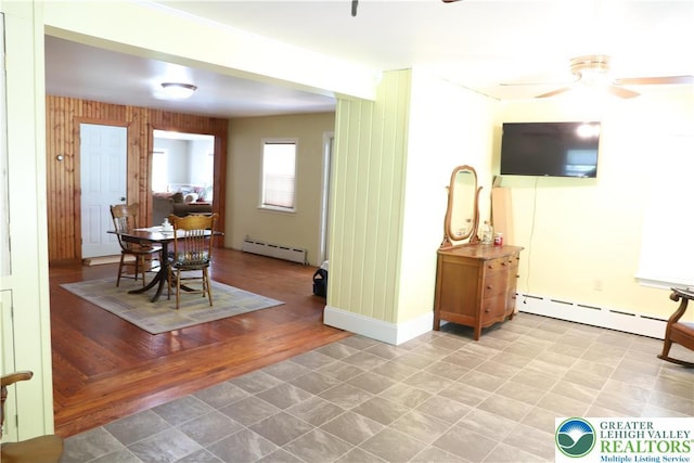 118 Burgoon Rd, Stroud Twp, PA 18301 - dining area featuring a baseboard radiator and ceiling fan