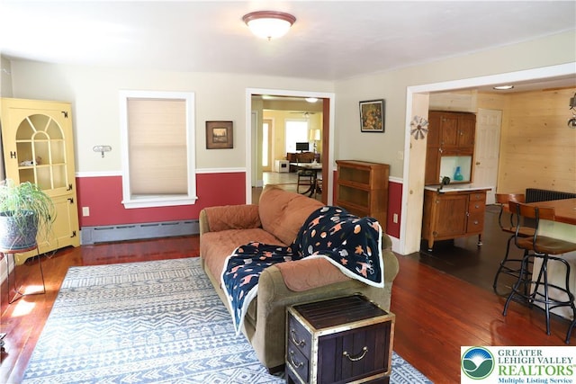 118 Burgoon Rd, Stroud Twp, PA 18301 - living area with a baseboard radiator and wood finished floors