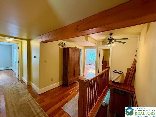 118 Burgoon Rd, Stroud Twp, PA 18301 - corridor featuring an upstairs landing, wood finished floors, and baseboards