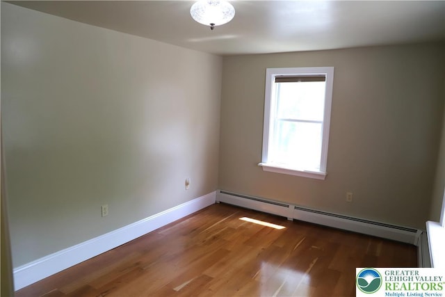 118 Burgoon Rd, Stroud Twp, PA 18301 - empty room with a baseboard radiator and wood finished floors