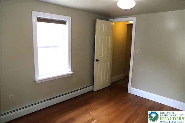118 Burgoon Rd, Stroud Twp, PA 18301 - unfurnished room with a baseboard radiator, wood finished floors, and baseboards
