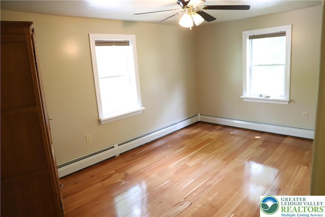 118 Burgoon Rd, Stroud Twp, PA 18301 - unfurnished room with a baseboard heating unit, ceiling fan, light wood-style flooring, and baseboard heating
