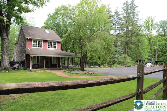 118 Burgoon Rd, Stroud Twp, PA 18301 - view of front of property with a porch, a front lawn, and asphalt driveway
