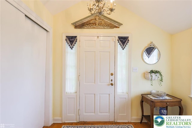 6650 Mountain Rd, Macungie Boro, PA 18062 - entryway with wood finished floors and a chandelier