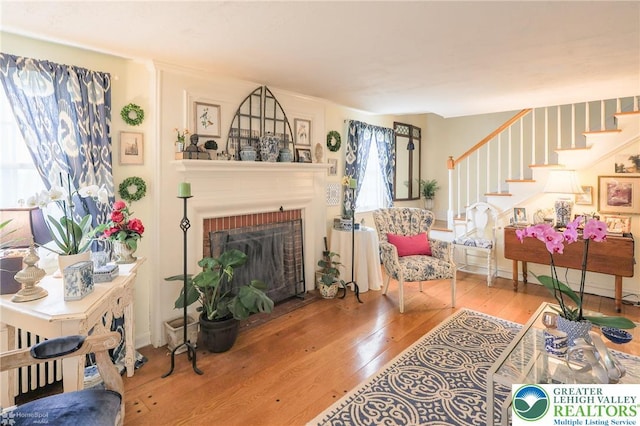 6650 Mountain Rd, Macungie Boro, PA 18062 - living area with wood-type flooring, stairs, and a fireplace