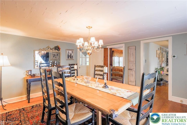 6650 Mountain Rd, Macungie Boro, PA 18062 - dining room with a chandelier, wood finished floors, and crown molding