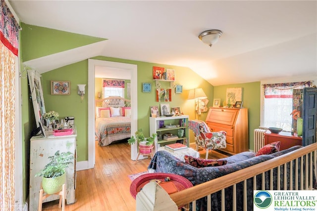 6650 Mountain Rd, Macungie Boro, PA 18062 - bedroom with radiator, vaulted ceiling, and hardwood / wood-style floors