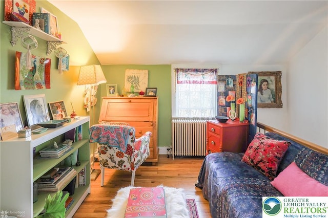 6650 Mountain Rd, Macungie Boro, PA 18062 - sitting room featuring radiator heating unit, lofted ceiling, and wood finished floors