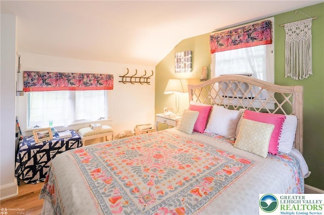 6650 Mountain Rd, Macungie Boro, PA 18062 - bedroom with lofted ceiling and wood finished floors