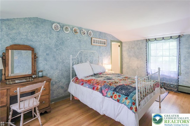 6650 Mountain Rd, Macungie Boro, PA 18062 - bedroom with wood finished floors, lofted ceiling, and wallpapered walls