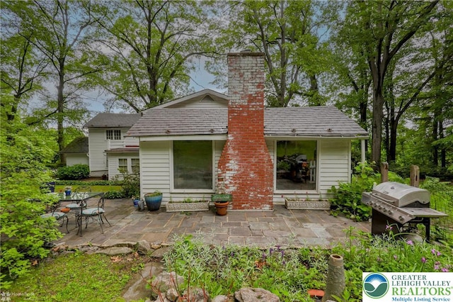 6650 Mountain Rd, Macungie Boro, PA 18062 - rear view of property featuring a patio and a chimney