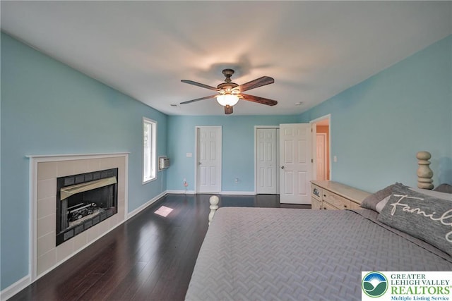 205 Osprey Way, Middle Smithfield Twp, PA 18302 - bedroom featuring dark wood-type flooring, a tile fireplace, and ceiling fan
