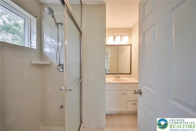 205 Osprey Way, Middle Smithfield Twp, PA 18302 - bathroom featuring tiled shower, vanity, and tile patterned floors