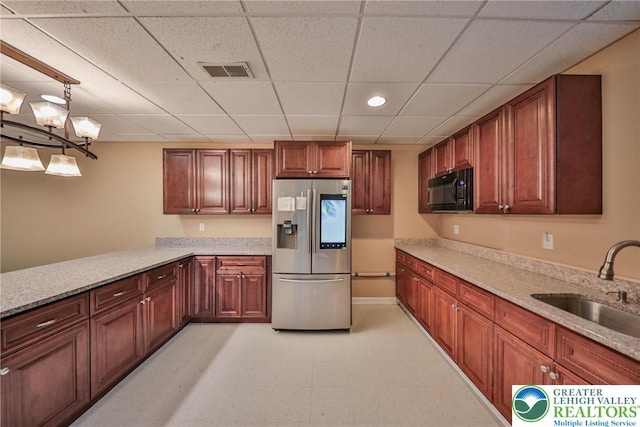 205 Osprey Way, Middle Smithfield Twp, PA 18302 - kitchen with stainless steel fridge, black microwave, a drop ceiling, a chandelier, and a peninsula