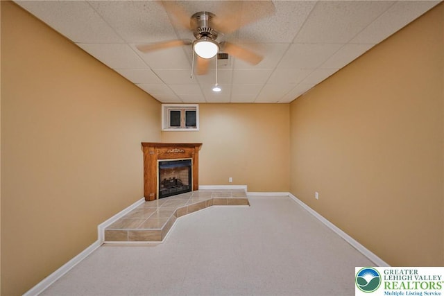 205 Osprey Way, Middle Smithfield Twp, PA 18302 - unfurnished living room with carpet flooring, a tile fireplace, a ceiling fan, and a paneled ceiling