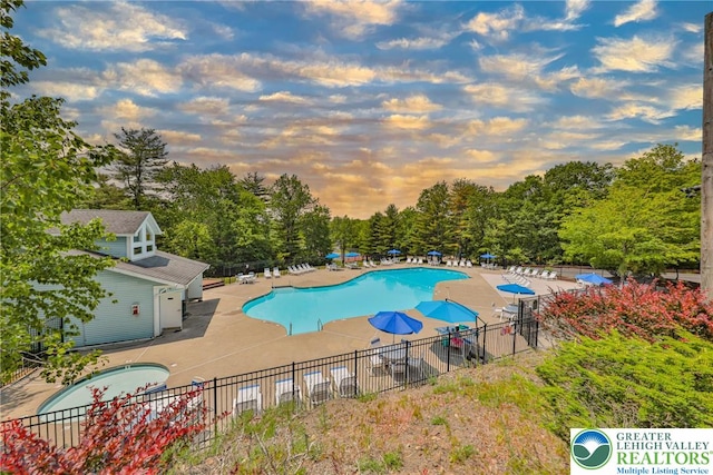 205 Osprey Way, Middle Smithfield Twp, PA 18302 - community pool featuring a patio and view of scattered trees