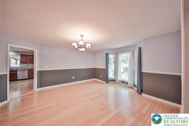 205 Osprey Way, Middle Smithfield Twp, PA 18302 - spare room with a chandelier and light wood-style flooring