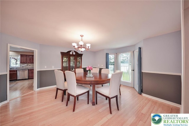 205 Osprey Way, Middle Smithfield Twp, PA 18302 - dining room featuring a chandelier and light wood-style flooring
