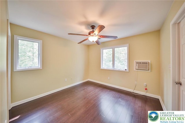 205 Osprey Way, Middle Smithfield Twp, PA 18302 - empty room featuring a wall unit AC, a ceiling fan, and dark wood-type flooring