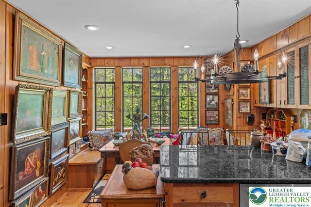 1341 Beaver Valley Rd, Hamilton Twp, PA 18360 - kitchen featuring wood walls, light wood-style flooring, dark stone countertops, and recessed lighting