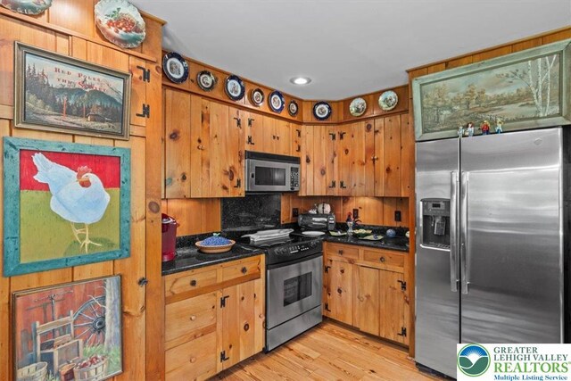 1341 Beaver Valley Rd, Hamilton Twp, PA 18360 - kitchen with appliances with stainless steel finishes, dark countertops, recessed lighting, light wood finished floors, and tasteful backsplash