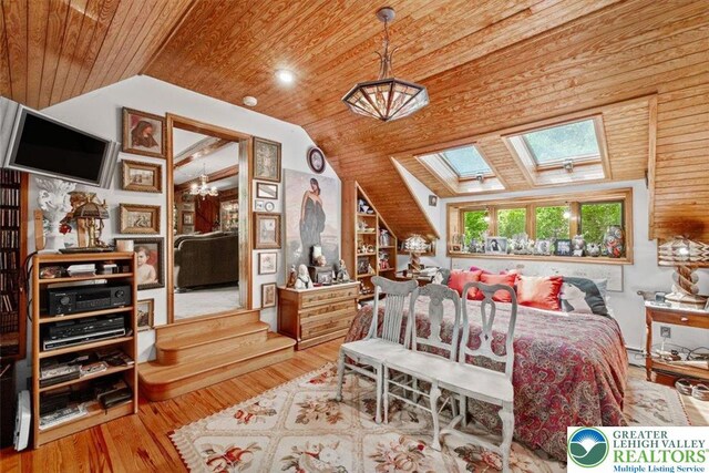 1341 Beaver Valley Rd, Hamilton Twp, PA 18360 - bedroom with wood ceiling, a skylight, lofted ceiling, and wood finished floors