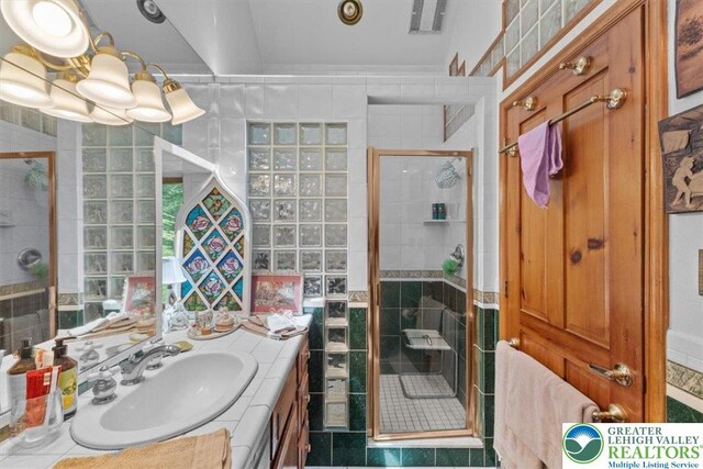 1341 Beaver Valley Rd, Hamilton Twp, PA 18360 - bathroom with vanity, a stall shower, tile patterned flooring, and tile walls