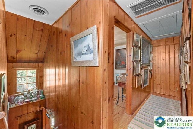 1341 Beaver Valley Rd, Hamilton Twp, PA 18360 - hallway with wooden walls, attic access, and wood finished floors