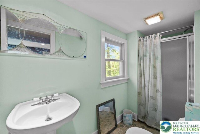 1341 Beaver Valley Rd, Hamilton Twp, PA 18360 - full bathroom featuring curtained shower and tile patterned floors