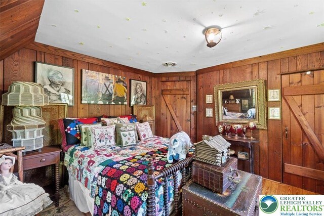 1341 Beaver Valley Rd, Hamilton Twp, PA 18360 - bedroom with wood walls and wood finished floors