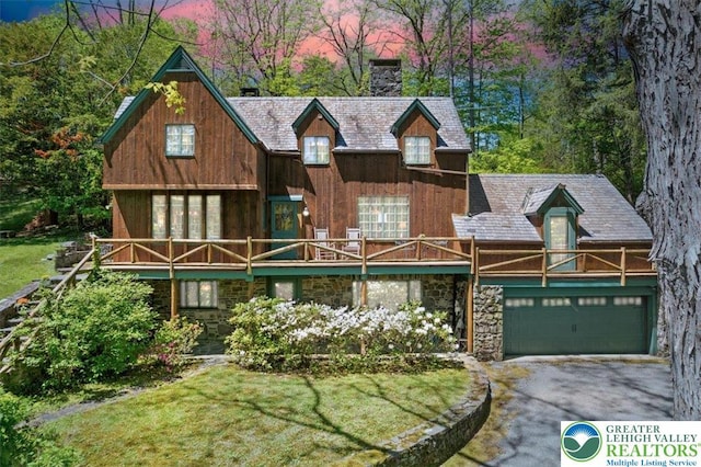 1341 Beaver Valley Rd, Hamilton Twp, PA 18360 - view of front of house with a chimney, driveway, stone siding, and a front yard