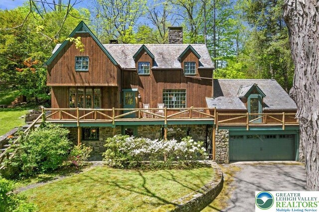 1341 Beaver Valley Rd, Hamilton Twp, PA 18360 - view of front of home with a chimney, driveway, a garage, and a front yard