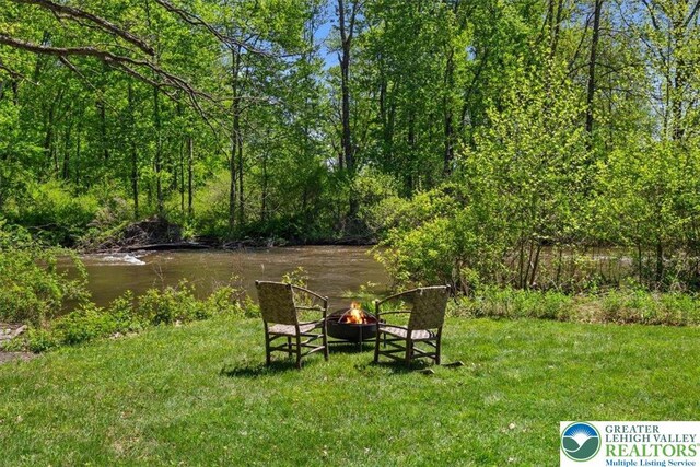 1341 Beaver Valley Rd, Hamilton Twp, PA 18360 - view of green lawn featuring an outdoor fire pit