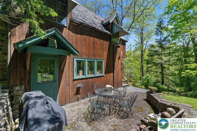 1341 Beaver Valley Rd, Hamilton Twp, PA 18360 - back of house featuring a patio and outdoor dining area