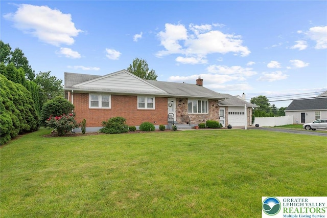 1122 N 14th St Unit 1126, Allentown City, PA 18102 - ranch-style house with an attached garage, driveway, a front yard, a chimney, and brick siding