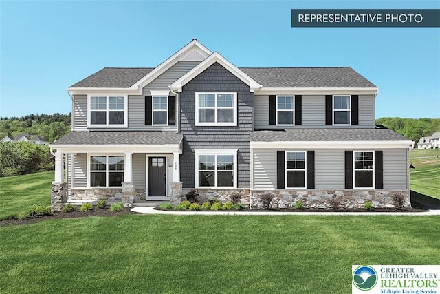 2010 Settlers Ridge Rd Lot 4, North Whitehall Twp, PA 18080 - view of front facade with stone siding, a front lawn, roof with shingles, and covered porch